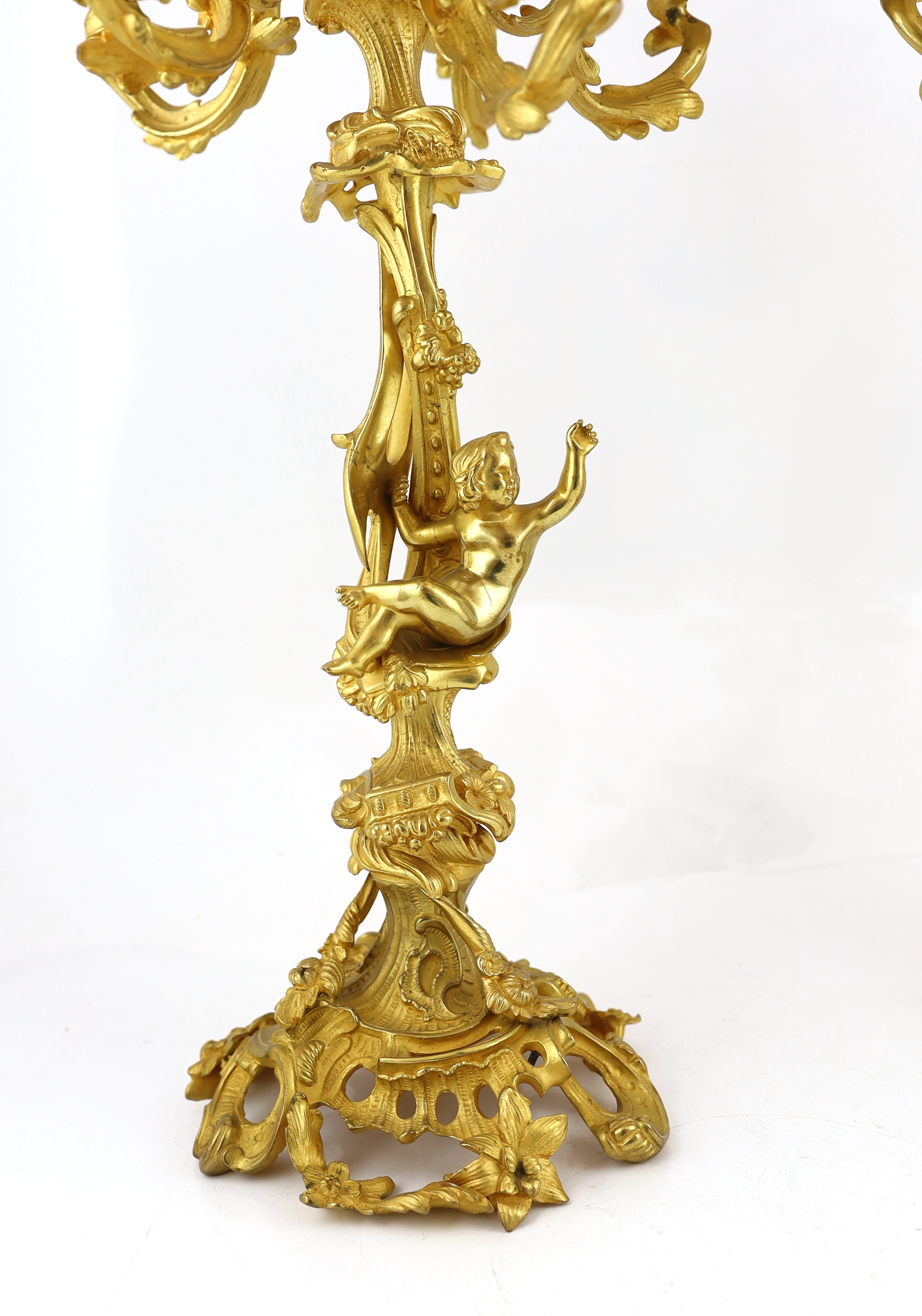 A pair of Victorian style ormolu six light candelabra 66cm high